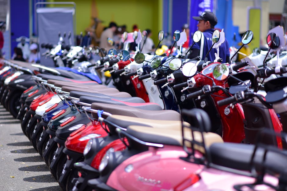 A vibrant row of scooters parked outdoors, offering a colorful display of modern urban transportation.